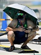 21 July 2021; Ireland coach Nico Peschier takes shade under an umbrella during a training session at the Kasai Canoe Slalom Centre ahead of the start of the 2020 Tokyo Summer Olympic Games in Tokyo, Japan. Photo by Brendan Moran/Sportsfile