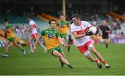 11 July 2021; Benny Heron of Derry in action against Eoin McHugh of Donegal during the Ulster GAA Football Senior Championship Quarter-Final match between Derry and Donegal at Páirc MacCumhaill in Ballybofey, Donegal. Photo by Stephen McCarthy/Sportsfile