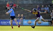 21 July 2021; Diarmuid Ó Dúlaing of Dublin in action against Cian Ó Tuama of Wexford during the Electric Ireland Leinster GAA Minor Hurling Championship Semi-Final match between Dublin and Wexford at Chadwicks Wexford Park in Wexford. Photo by Daire Brennan/Sportsfile