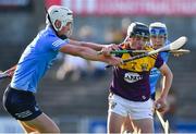 21 July 2021; Robbie Chapman of Wexford in action against Leon Kennedy of Dublin during the Electric Ireland Leinster GAA Minor Hurling Championship Semi-Final match between Dublin and Wexford at Chadwicks Wexford Park in Wexford. Photo by Daire Brennan/Sportsfile