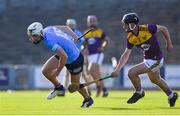 21 July 2021; Leon Kennedy of Dublin in action against Robbie Chapman of Wexford during the Electric Ireland Leinster GAA Minor Hurling Championship Semi-Final match between Dublin and Wexford at Chadwicks Wexford Park in Wexford. Photo by Daire Brennan/Sportsfile