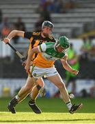 21 July 2021; Andrew Coakley of Offaly in action against Bill Hughes of Kilkenny during the Electric Ireland Leinster GAA Minor Hurling Championship Semi-Final match between Kilkenny and Offaly at UPMC Nowlan Park in Kilkenny. Photo by Eóin Noonan/Sportsfile