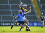 21 July 2021; Conal Ó Riain of Dublin in action against Seán Cooney of Wexford during the Electric Ireland Leinster GAA Minor Hurling Championship Semi-Final match between Dublin and Wexford at Chadwicks Wexford Park in Wexford. Photo by Daire Brennan/Sportsfile