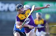 21 July 2021; Robbie Chapman of Wexford in action against Conn Rock of Dublin during the Electric Ireland Leinster GAA Minor Hurling Championship Semi-Final match between Dublin and Wexford at Chadwicks Wexford Park in Wexford. Photo by Daire Brennan/Sportsfile