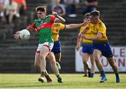 21 July 2021; Jack Mahon of Mayo in action against James Fitzpatrick, left, and Conor Lohan of Roscommon during the EirGrid Connacht GAA Football U20 Championship Final match between Mayo and Roscommon at Elverys MacHale Park in Castlebar, Mayo. Photo by Piaras Ó Mídheach/Sportsfile
