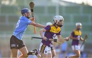 21 July 2021; Cillian Byrne of Wexford in action against Ben Gaughran of Dublin during the Electric Ireland Leinster GAA Minor Hurling Championship Semi-Final match between Dublin and Wexford at Chadwicks Wexford Park in Wexford. Photo by Daire Brennan/Sportsfile