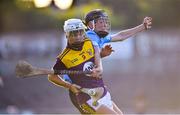 21 July 2021; Cillian Byrne of Wexford in action against Eoin Keys of Dublin during the Electric Ireland Leinster GAA Minor Hurling Championship Semi-Final match between Dublin and Wexford at Chadwicks Wexford Park in Wexford. Photo by Daire Brennan/Sportsfile