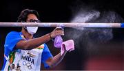 22 July 2021; India coach Lahkan Sharma sprays down the bars during a training session at the Ariake Gymnastics Arena ahead of the start of the 2020 Tokyo Summer Olympic Games in Tokyo, Japan. Photo by Ramsey Cardy/Sportsfile