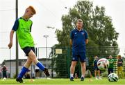 22 July 2021; Republic of Ireland manager Stephen Kenny encourages kids taking part in the INTERSPORT Elverys Summer Soccer Schools at Templeogue United FC in Dublin. Photo by Eóin Noonan/Sportsfile