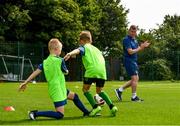 22 July 2021; Republic of Ireland manager Stephen Kenny encourages kids taking part in the INTERSPORT Elverys Summer Soccer Schools at Templeogue United FC in Dublin. Photo by Eóin Noonan/Sportsfile