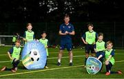 22 July 2021; Republic of Ireland manager Stephen Kenny with, from left, Dylan Keane, Abbie Catiner, Taaffe, Jamie Coleman, Luke Doyle, Holly Farrell and Jack Linehan during a visit to the INTERSPORT Elverys Summer Soccer Schools at Templeogue United FC in Dublin. Photo by Eóin Noonan/Sportsfile