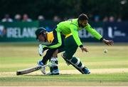 22 July 2021; Simi Singh of Ireland collides with David Miller of South Africa during the Men's T20 International match between Ireland and South Africa at Stormont in Belfast. Photo by David Fitzgerald/Sportsfile