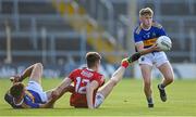 22 July 2021; Billy O'Connor of Tipperary gets past team-mate Cathal Deeley and Niall Hartnett of Cork during the EirGrid Munster GAA Football U20 Championship Final match between Cork and Tipperary at Semple Stadium in Thurles, Tipperary. Photo by Piaras Ó Mídheach/Sportsfile