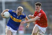 22 July 2021; Ryan Walsh of Tipperary in action against Conor McGoldrick of Cork during the EirGrid Munster GAA Football U20 Championship Final match between Cork and Tipperary at Semple Stadium in Thurles, Tipperary. Photo by Piaras Ó Mídheach/Sportsfile