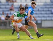 22 July 2021; Fionn Dempsey of Offaly in action against Adam Waddick of Dublin during the EirGrid Leinster GAA Football U20 Championship Final match between Dublin and Offaly at MW Hire O'Moore Park in Portlaoise, Laois. Photo by Matt Browne/Sportsfile