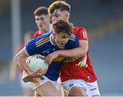 22 July 2021; Emmet Butler of Tipperary is tackled by Darragh Cashman of Cork during the EirGrid Munster GAA Football U20 Championship Final match between Cork and Tipperary at Semple Stadium in Thurles, Tipperary. Photo by Piaras Ó Mídheach/Sportsfile
