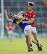 22 July 2021; Conor Cadell of Tipperary is tackled by Darragh Cashman of Cork during the EirGrid Munster GAA Football U20 Championship Final match between Cork and Tipperary at Semple Stadium in Thurles, Tipperary. Photo by Piaras Ó Mídheach/Sportsfile