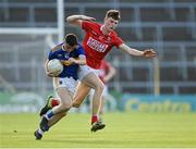 22 July 2021; Conor Cadell of Tipperary in action against Niall Hartnett of Cork during the EirGrid Munster GAA Football U20 Championship Final match between Cork and Tipperary at Semple Stadium in Thurles, Tipperary. Photo by Piaras Ó Mídheach/Sportsfile