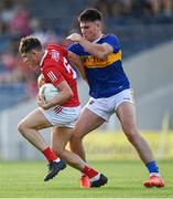 22 July 2021; Adam Walsh-Murphy of Cork in action against Keith Grogan of Tipperary during the EirGrid Munster GAA Football U20 Championship Final match between Cork and Tipperary at Semple Stadium in Thurles, Tipperary. Photo by Piaras Ó Mídheach/Sportsfile