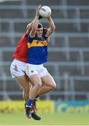 22 July 2021; Seán O'Connor of Tipperary in action against Colm O'Donovan of Cork during the EirGrid Munster GAA Football U20 Championship Final match between Cork and Tipperary at Semple Stadium in Thurles, Tipperary. Photo by Piaras Ó Mídheach/Sportsfile