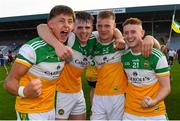 22 July 2021; Offaly players from left Ed Cullen, Cathal Donoghue, Mikey Cunningham and Darragh Flynn celebrate after the EirGrid Leinster GAA Football U20 Championship Final match between Dublin and Offaly at MW Hire O'Moore Park in Portlaoise, Laois. Photo by Matt Browne/Sportsfile