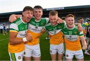 22 July 2021; Offaly players from left Ed Cullen, Cathal Donoghue, Mikey Cunningham and Darragh Flynn celebrate after the EirGrid Leinster GAA Football U20 Championship Final match between Dublin and Offaly at MW Hire O'Moore Park in Portlaoise, Laois. Photo by Matt Browne/Sportsfile