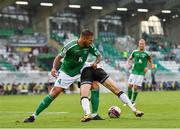 22 July 2021; David McMillan of Dundalk is tackled by Maximiliano Uggè of Levadia during the UEFA Europa Conference League second qualifying round first leg match between Dundalk and Levadia at Tallaght Stadium in Dublin. Photo by Eóin Noonan/Sportsfile