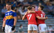 22 July 2021; Cork players, from left, Darragh Cashman, Adam Walsh-Murphy and Neil Lordan celebrate after their side's victory in the EirGrid Munster GAA Football U20 Championship Final match between Cork and Tipperary at Semple Stadium in Thurles, Tipperary. Photo by Piaras Ó Mídheach/Sportsfile