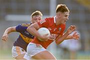 22 July 2021; Darragh Cashman of Cork in action against Leon Kennedy of Tipperary during the EirGrid Munster GAA Football U20 Championship Final match between Cork and Tipperary at Semple Stadium in Thurles, Tipperary. Photo by Piaras Ó Mídheach/Sportsfile