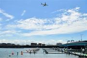 23 July 2021; An aeroplane approaches Tokyo Haneda International Airport as teams line up for their women's double sculls heat race at the Sea Forest Waterway during the 2020 Tokyo Summer Olympic Games in Tokyo, Japan. Photo by Seb Daly/Sportsfile
