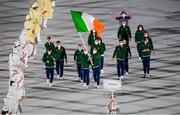 23 July 2021; Team Ireland flagbearers Kellie Harrington, right, and Brendan Irvine carry the Irish tricolour during the 2020 Tokyo Summer Olympic Games opening ceremony at the Olympic Stadium in Tokyo, Japan. Photo by Stephen McCarthy/Sportsfile