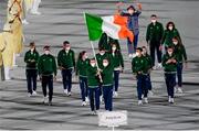 23 July 2021; Team Ireland flagbearers Kellie Harrington, right, and Brendan Irvine carry the Irish tricolour during the 2020 Tokyo Summer Olympic Games opening ceremony at the Olympic Stadium in Tokyo, Japan. Photo by Stephen McCarthy/Sportsfile