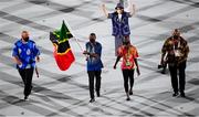 23 July 2021; Team Saint Kitts and Nevis flagbearers Amya Clarke and Jason Rogers carry the Saint Kitts and Nevis flag during the 2020 Tokyo Summer Olympic Games opening ceremony at the Olympic Stadium in Tokyo, Japan. Photo by Stephen McCarthy/Sportsfile