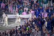 23 July 2021; Representatives of the six federations bring out the olympic flag during the 2020 Tokyo Summer Olympic Games opening ceremony at the Olympic Stadium in Tokyo, Japan. Photo by Stephen McCarthy/Sportsfile