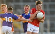 22 July 2021; Darragh Cashman of Cork is tackled by Conor Cadell of Tipperary, 10, during the EirGrid Munster GAA Football U20 Championship Final match between Cork and Tipperary at Semple Stadium in Thurles, Tipperary. Photo by Piaras Ó Mídheach/Sportsfile