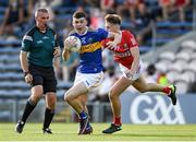 22 July 2021; Seán O'Connor of Tipperary in action against Darragh Cashman of Cork during the EirGrid Munster GAA Football U20 Championship Final match between Cork and Tipperary at Semple Stadium in Thurles, Tipperary. Photo by Piaras Ó Mídheach/Sportsfile