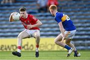 22 July 2021; David Buckley of Cork in action against Jake Kiely of Tipperary during the EirGrid Munster GAA Football U20 Championship Final match between Cork and Tipperary at Semple Stadium in Thurles, Tipperary. Photo by Piaras Ó Mídheach/Sportsfile
