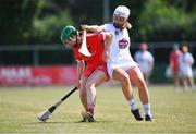24 July 2021; Fiona Neville of Cork in action against Niamh Hegarty of Kildare during the All Ireland Intermediate Camogie Championship match between Kildare and Cork at Manguard Plus Kildare GAA Centre of Excellence in Newbridge, Kildare. Photo by Daire Brennan/Sportsfile