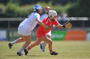 24 July 2021; Aoife Hurley of Cork in action against Ellen Morgan of Kildare during the All Ireland Intermediate Camogie Championship match between Kildare and Cork at Manguard Plus Kildare GAA Centre of Excellence in Newbridge, Kildare. Photo by Daire Brennan/Sportsfile