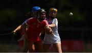 24 July 2021; Michelle Murphy of Cork in action against Caoimhe Maher of Kildare during the All Ireland Intermediate Camogie Championship match between Kildare and Cork at Manguard Plus Kildare GAA Centre of Excellence in Newbridge, Kildare. Photo by Daire Brennan/Sportsfile