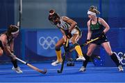 24 July 2021; Quanita Bobbs of South Africa is nutmegged Sarah Torrans of Ireland, left, during the Women's Pool A Group Stage match between Ireland and South Africa at the Oi Hockey Stadium during the 2020 Tokyo Summer Olympic Games in Tokyo, Japan. Photo by Ramsey Cardy/Sportsfile