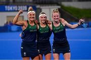 24 July 2021; Ireland players, from left, Lena Tice, Chloe Watkins and Hannah Matthews celebrate following victory in the Women's Pool A Group Stage match between Ireland and South Africa at the Oi Hockey Stadium during the 2020 Tokyo Summer Olympic Games in Tokyo, Japan. Photo by Ramsey Cardy/Sportsfile