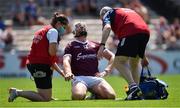 24 July 2021; Joe Canning of Galway is attended to by chartered physiotherapist Rachel Wyer and the team doctor Dr Ian O'Connor after being struck on the wrist near the end of the first half during the GAA Hurling All-Ireland Senior Championship Round 2 match between Waterford and Galway at Semple Stadium in Thurles, Tipperary. Photo by Ray McManus/Sportsfile