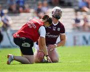 24 July 2021; Joe Canning of Galway is attended to by chartered physiotherapist Rachel Wyer after being struck on the wrist near the end of the first half during the GAA Hurling All-Ireland Senior Championship Round 2 match between Waterford and Galway at Semple Stadium in Thurles, Tipperary. Photo by Ray McManus/Sportsfile