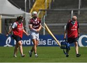 24 July 2021; Joe Canning of Galway leaves the field with chartered physiotherapist Rachel Wyer and the team doctor Dr Ian O'Connor after being struck on the wrist near the end of the first half during the GAA Hurling All-Ireland Senior Championship Round 2 match between Waterford and Galway at Semple Stadium in Thurles, Tipperary. Photo by Harry Murphy/Sportsfile