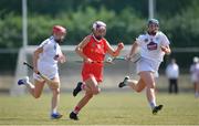 24 July 2021; Katie Walsh of Cork in action against Maria Doyle, left, and Siobhán Hurley of Kildare during the All Ireland Intermediate Camogie Championship match between Kildare and Cork at Manguard Plus Kildare GAA Centre of Excellence in Newbridge, Kildare. Photo by Daire Brennan/Sportsfile