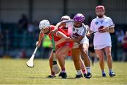 24 July 2021; Kate Wall of Cork in action against Nicole Malcolmson of Kildare during the All Ireland Intermediate Camogie Championship match between Kildare and Cork at Manguard Plus Kildare GAA Centre of Excellence in Newbridge, Kildare. Photo by Daire Brennan/Sportsfile