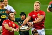 24 July 2021; Cheslin Kolbe of South Africa in action against Duhan van der Merwe, right, and Robbie Henshaw of the British and Irish Lions during the first test of the British and Irish Lions tour match between South Africa and British and Irish Lions at Cape Town Stadium in Cape Town, South Africa. Photo by Ashley Vlotman/Sportsfile