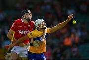 23 July 2021; Aron Shanagher of Clare in action against Robert Downey of Cork during the GAA Hurling All-Ireland Senior Championship Round 2 match between Clare and Cork at LIT Gaelic Grounds in Limerick. Photo by Eóin Noonan/Sportsfile