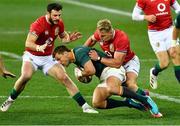 24 July 2021; Handré Pollard of South Africa is tackled by Duhan van der Merwe of the British and Irish Lions during the first test of the British and Irish Lions tour match between South Africa and British and Irish Lions at Cape Town Stadium in Cape Town, South Africa. Photo by Ashley Vlotman/Sportsfile